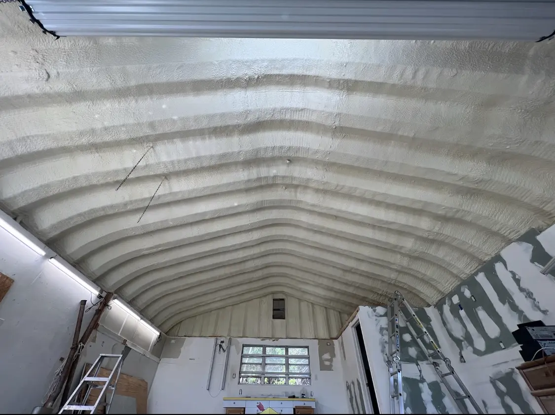 Spray polyurethane foam applied to the underside of a metal roof deck in Belvedere